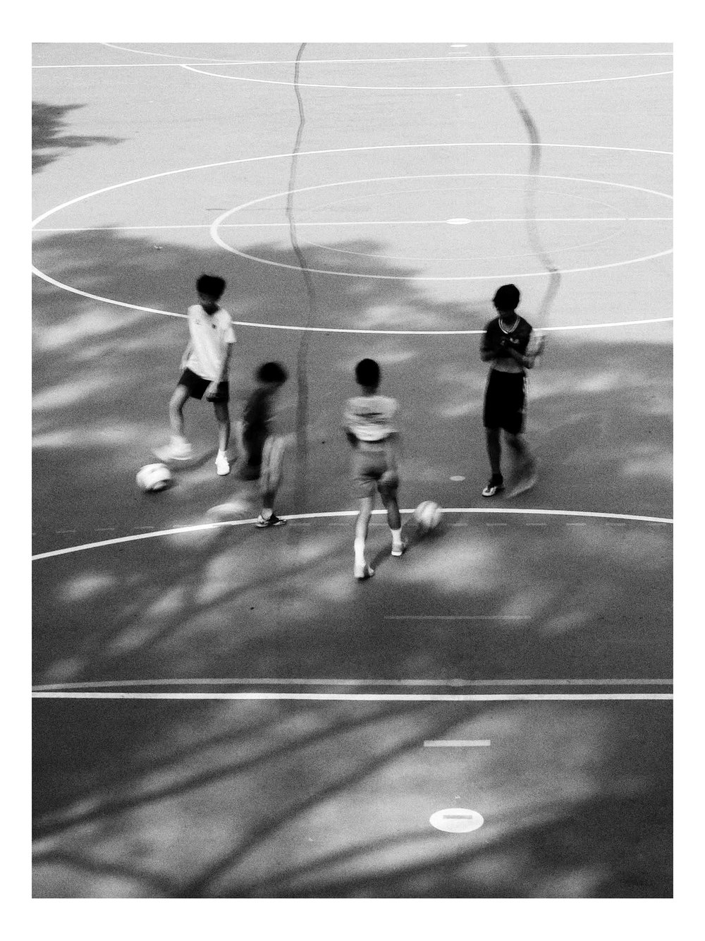 Children playing a pickup game on the court